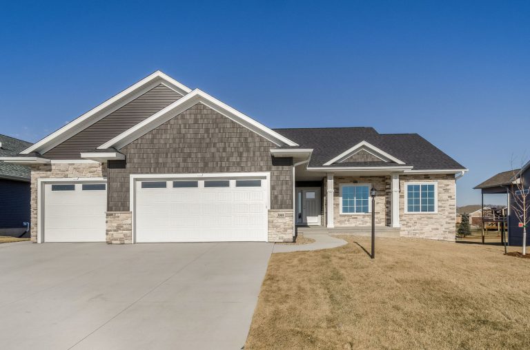 front of home with lampost in yard