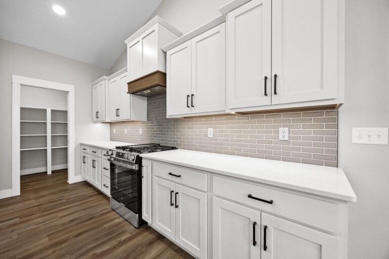 kitchen cabinets stove with hood, next to pantry