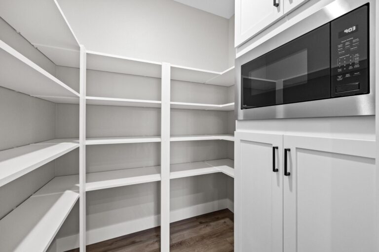 pantry shelving with built in microwave and cabinets