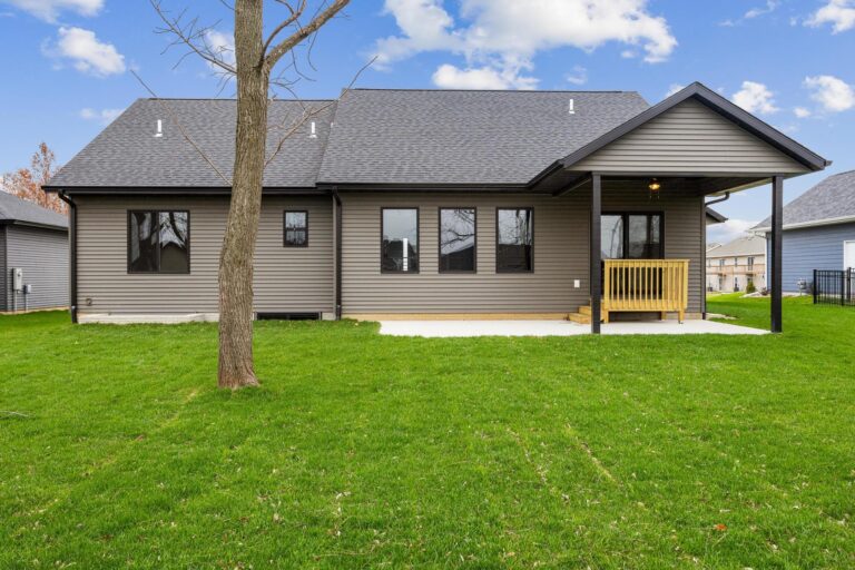 back of home with porch and patio