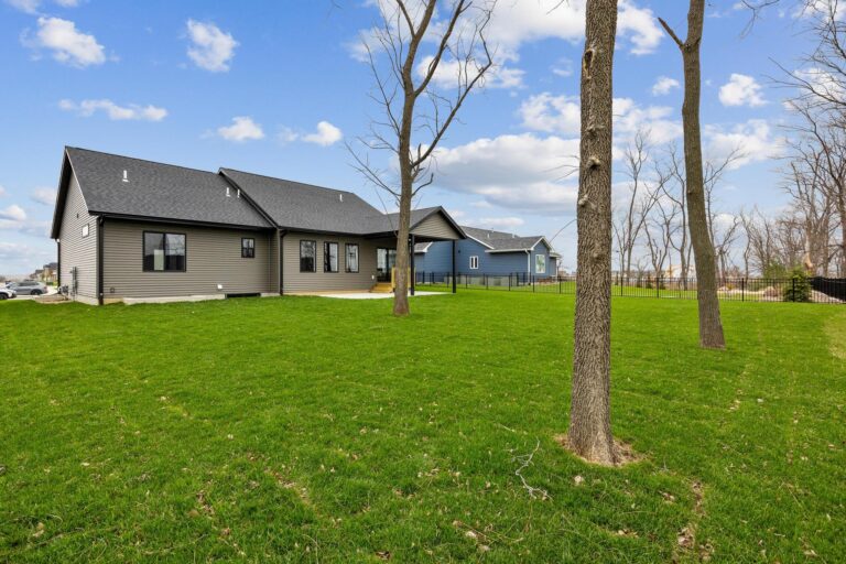 backyard of home with trees in yard