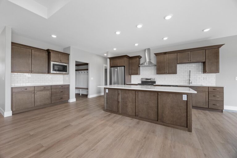 kitchen island, cabinets, stainless steel appliances